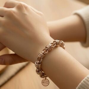 Bronze Italy Dyadema Elegant Rose Gold Knot-Link Bracelet with Branded Charm